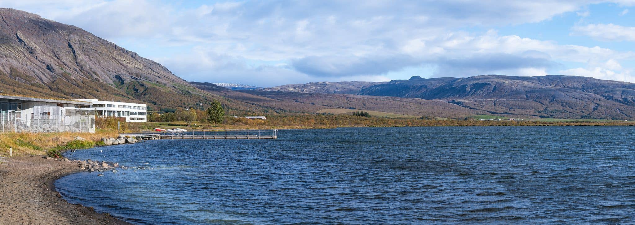 The geothermal lake of Laugarvatn lies below the mountains on the Golden Circle in South Iceland.