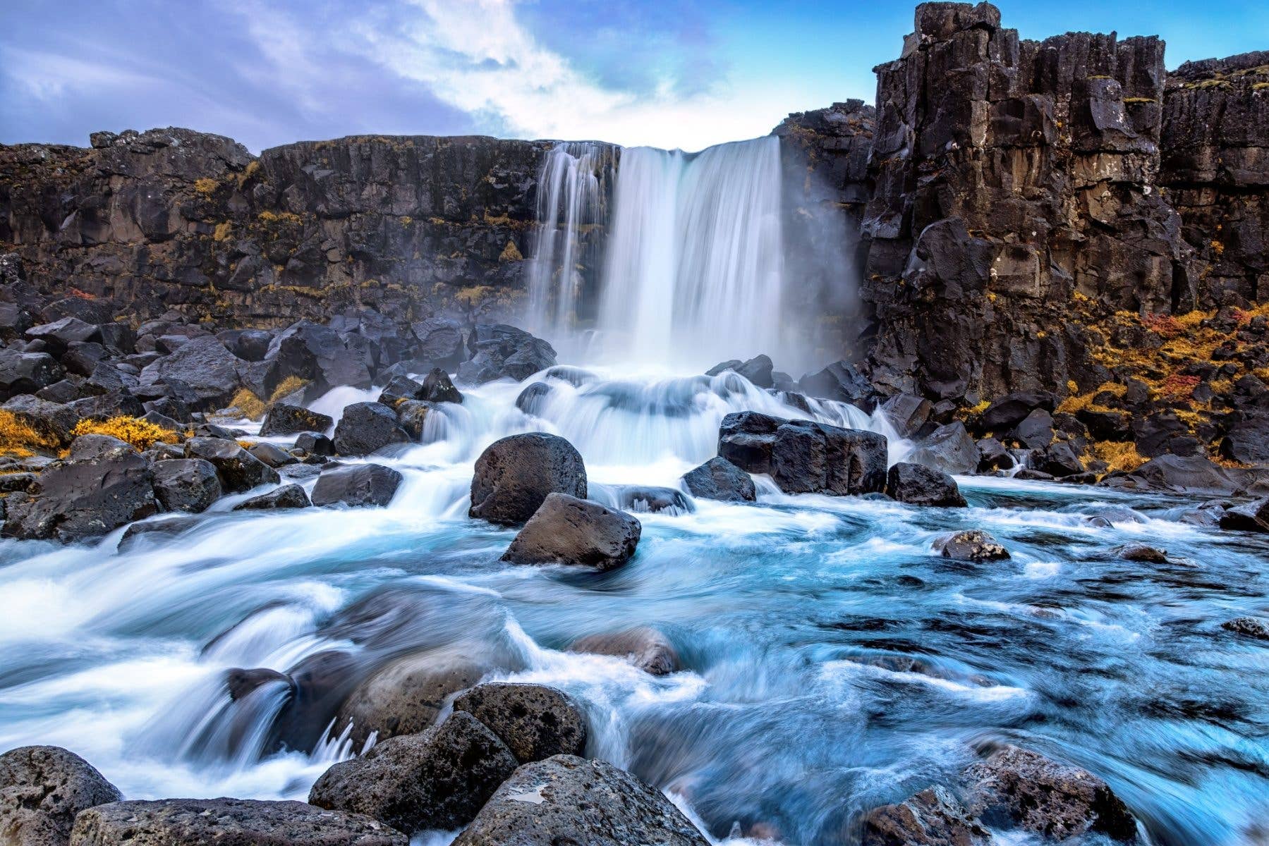The Öxarárfoss waterfall spills into the rift valley at Þingvellir National Park in Iceland.