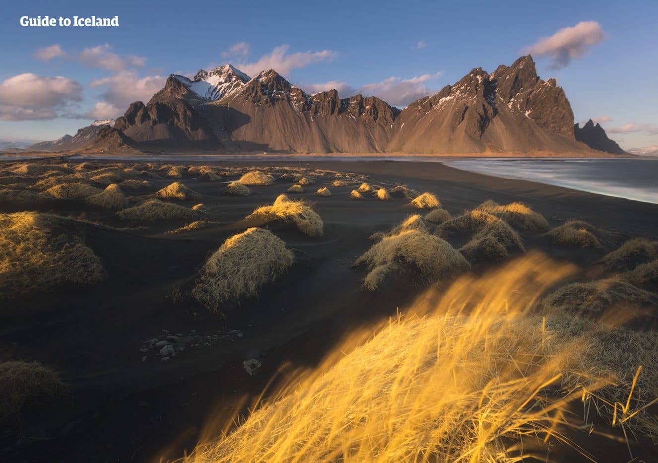 The dramatic Vestrahorn mountain rises above the black sands of Stokksnes in Southeast Iceland.