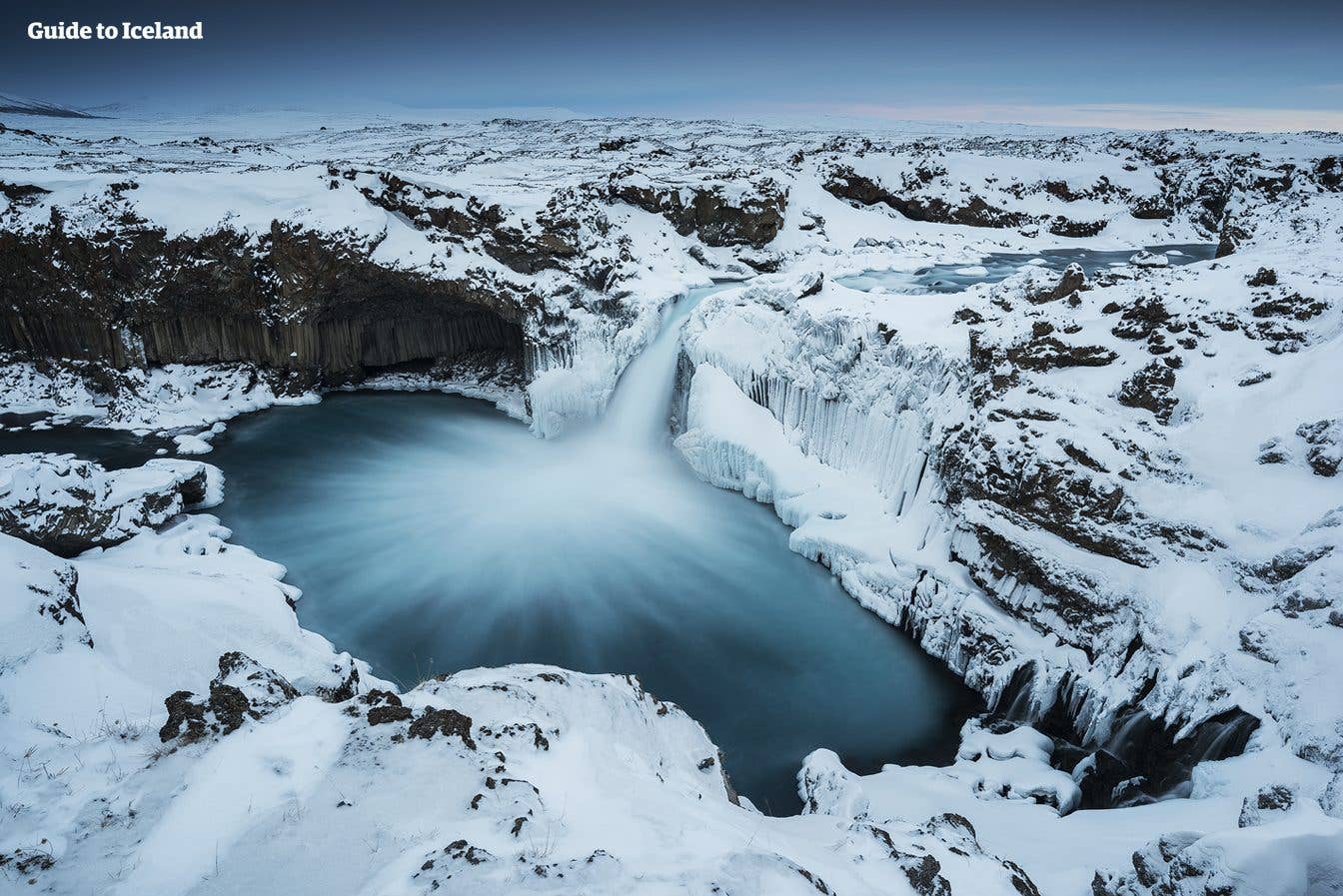 The turquoise pool of Aldeyjarfoss sits beneath columnar basalt in North Iceland.