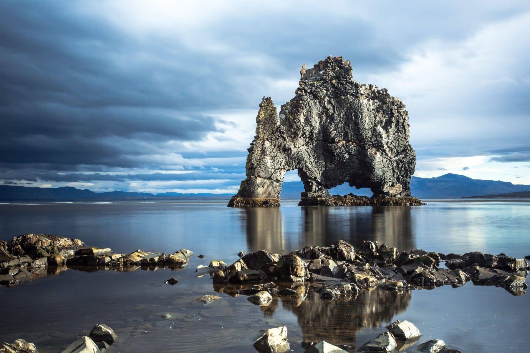 The Hvítserkur sea rock rises from the water off the Vatnsnes Peninsula in North Iceland.