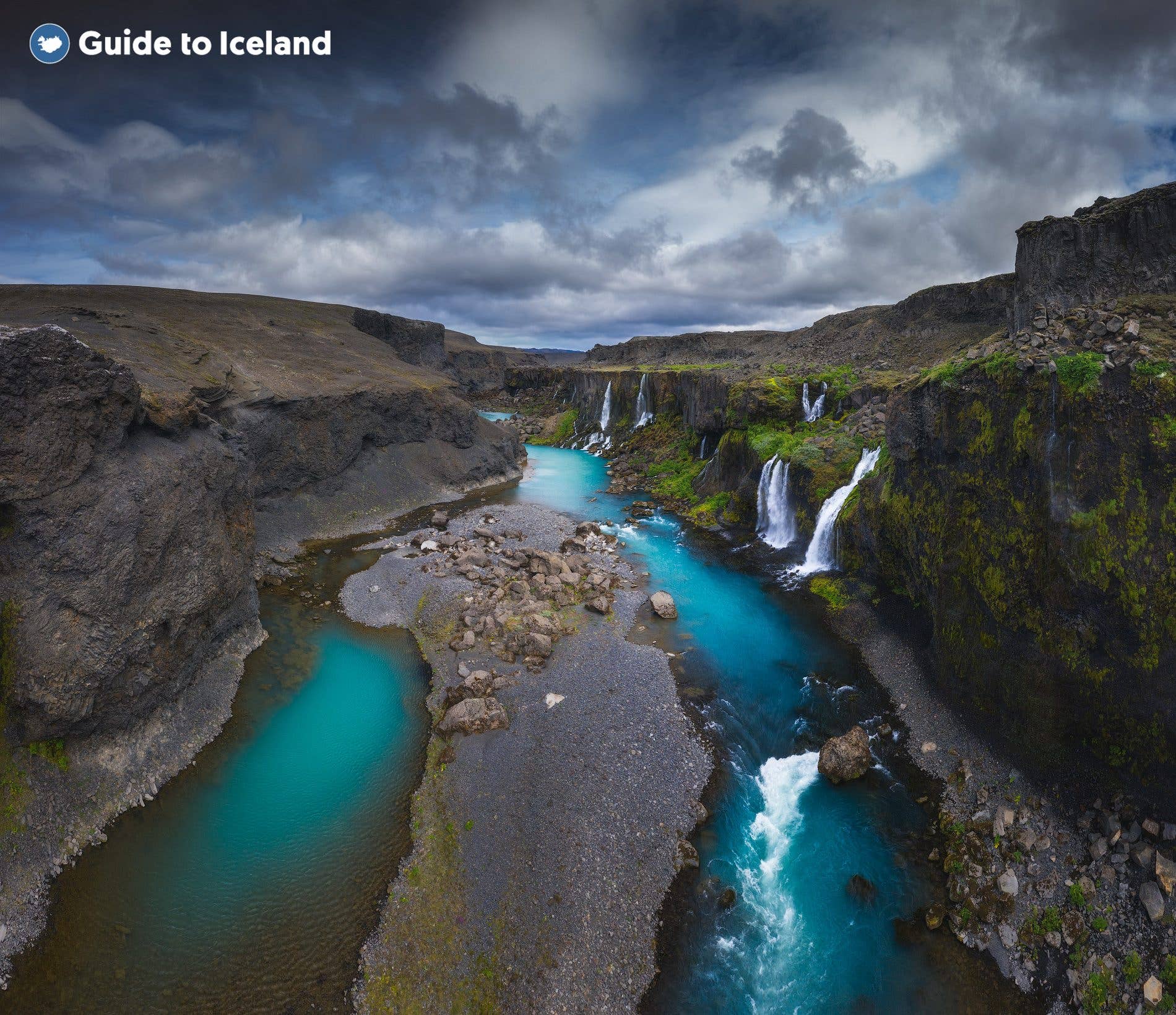Dozens of waterfalls pour into the turquoise river of Sigöldugljúfur canyon in the highlands of Iceland.