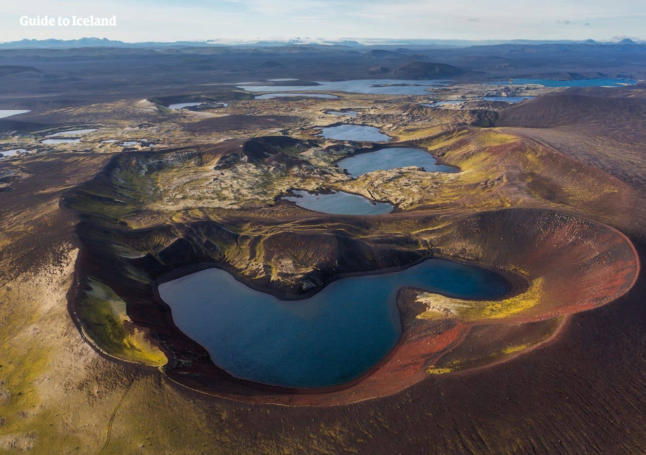 The Veiðivötn lakes scatter across the black volcanic highlands of Iceland.