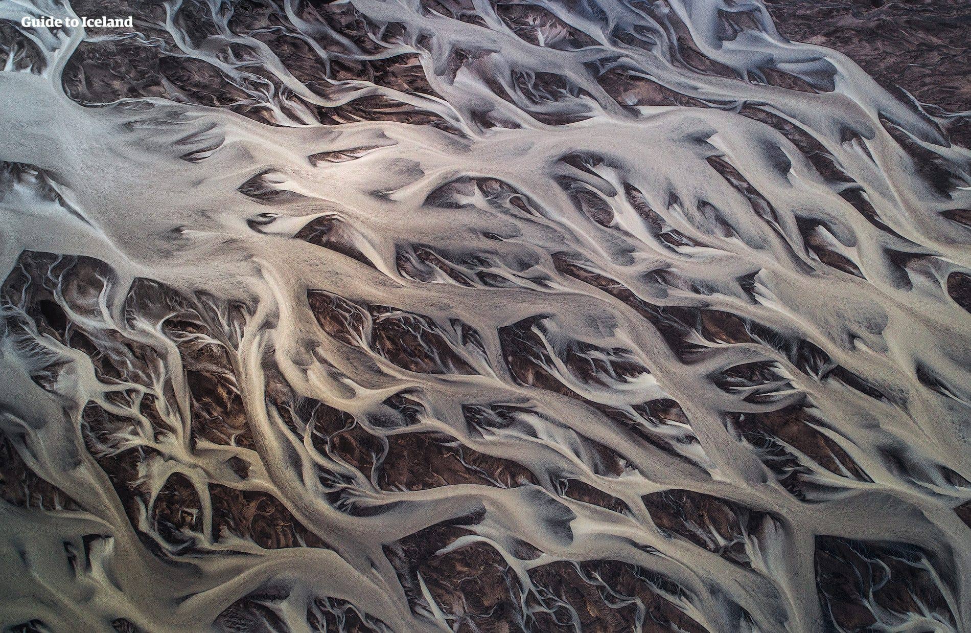 The glacial river Tungnaá braids across the black highland sands of Iceland.