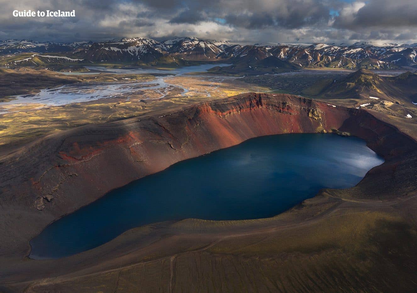 Blue lakes dot the green and black volcanic landscape of Veiðivötn in the Icelandic highlands.