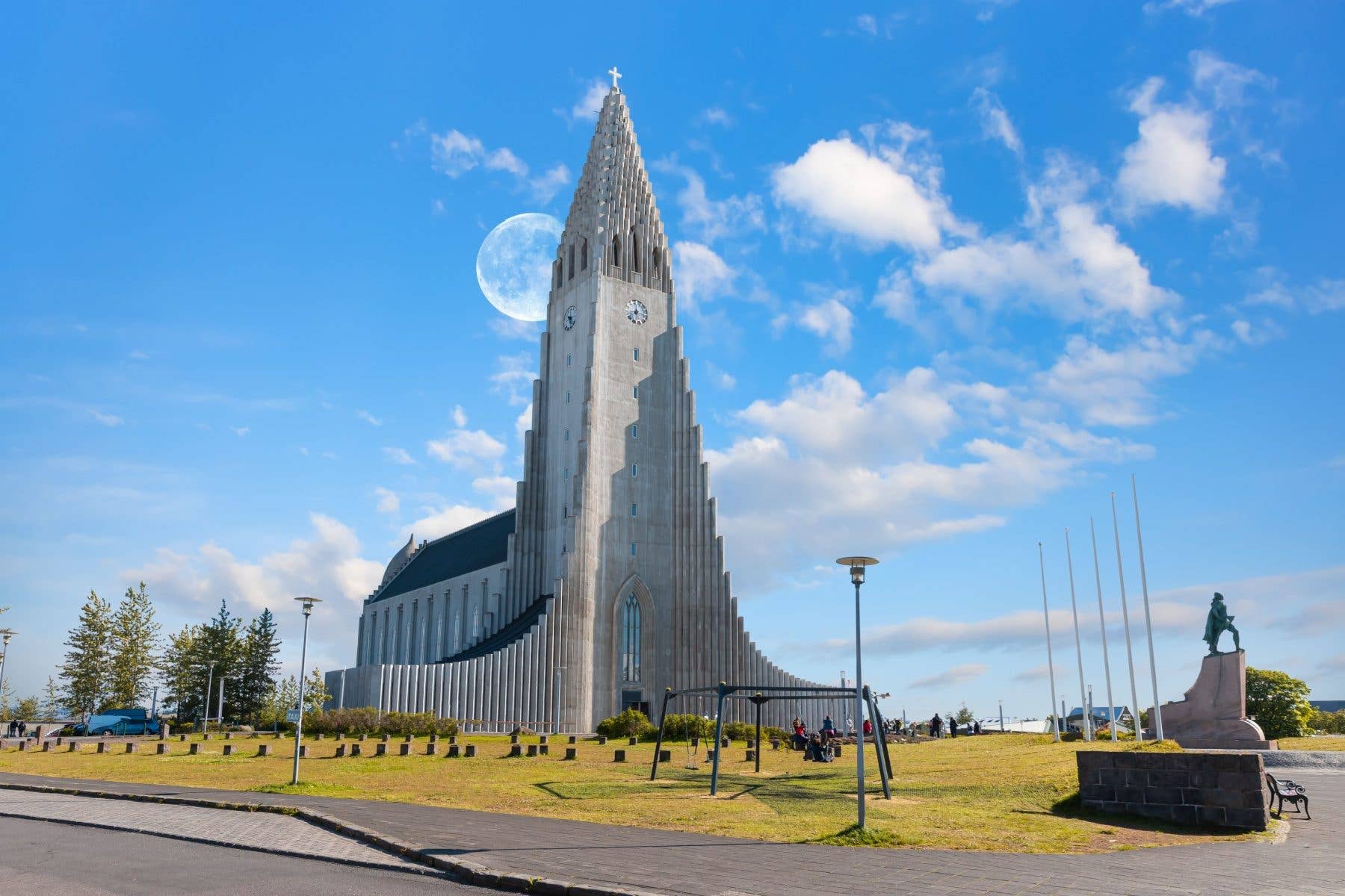 The Hallgrímskirkja church towers over Reykjavík under a bright summer sky in Iceland.