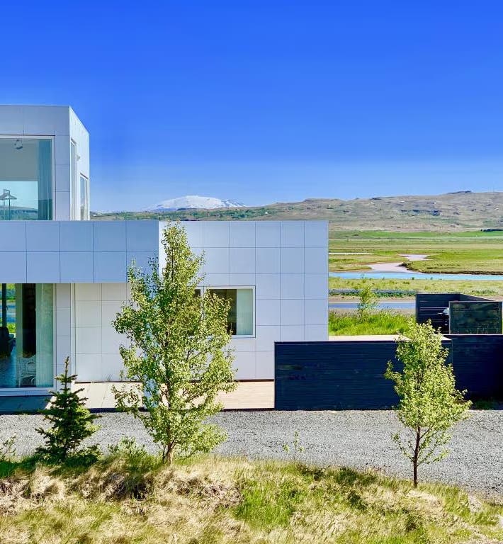 Laugaras Luxury Lodge near the Golden Circle in Iceland, under the bright summer sky.