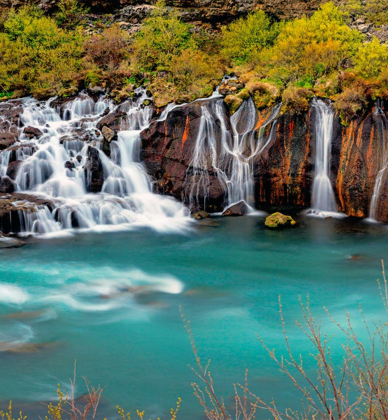 Hraunfossar Waterfalls flowing from a lava field into the Hvita River in West Iceland.