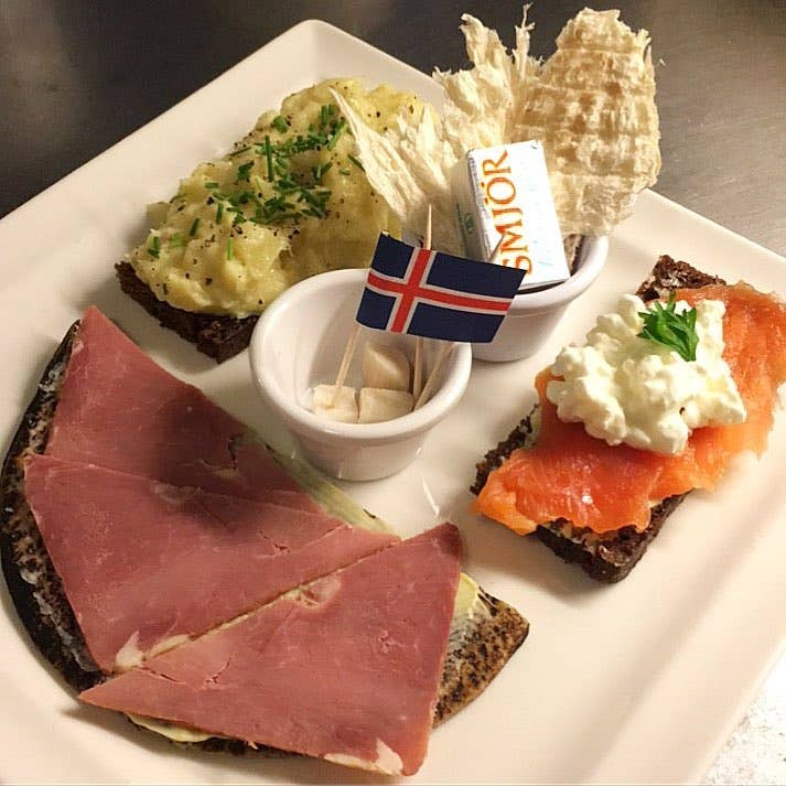 Cafe Loki's Icelandic Plate II: mashed fish on rye bread, smoked lamb flatbread, smoked trout, dried fish, and fermented shark.