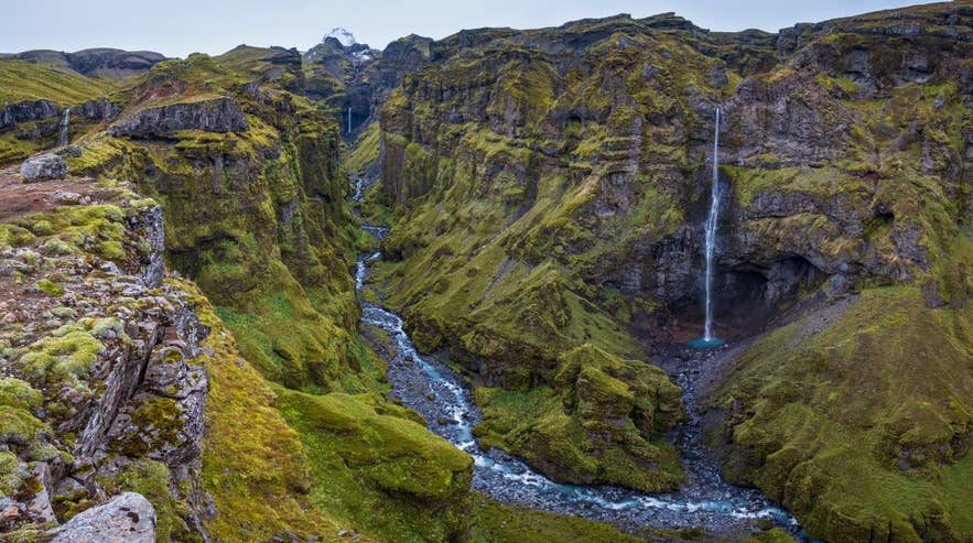 Hangandifoss Waterfall falling into the mossy Mulagljufur Canyon in Southeast Iceland.