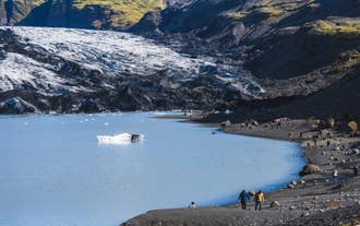 A small iceberg floats in the meltwater lagoon below Solheimajokull Glacier in South Iceland.