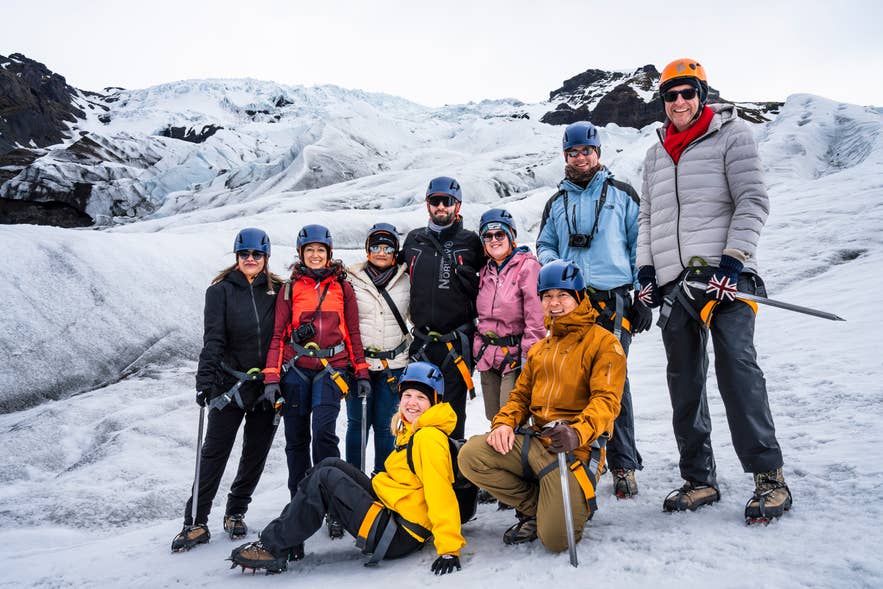 Group in helmets and crampons on a glacier hike Group in helmets and crampons on a glacier hike