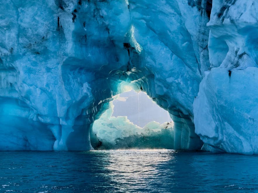 A melting iceberg in the Jokulsarlon Glacier Lagoon under the summer heat A melting iceberg in the Jokulsarlon Glacier Lagoon under the summer heat