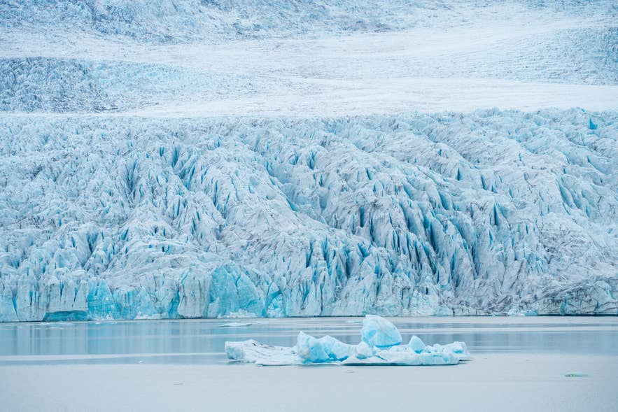 Crevassed glacier tongue and icebergs near Hofn, the landscape explored at the Glaciers of Hofn exhibition.