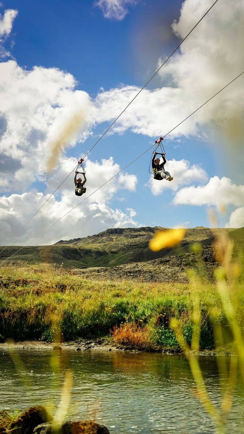 Zipline landing by the river at the Reykjadalur trailhead below Svartagljúfur