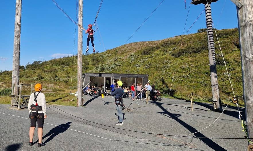 Timber poles, giant swing and service building at Adrenalin Adventure Park, Nesjavellir
