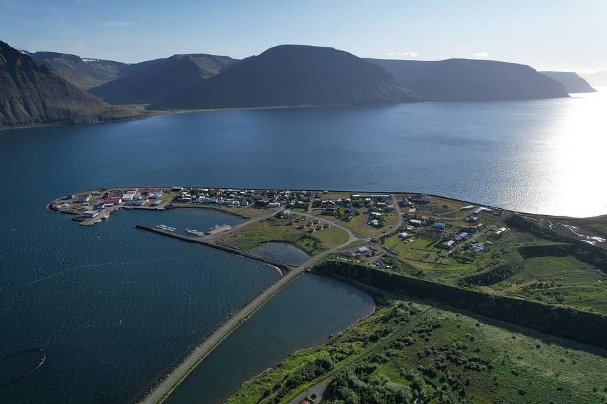 Aerial view of Flateyri village on its spit in Önundarfjörður with the avalanche dam behind Aerial view of Flateyri village on its spit in Önundarfjörður with the avalanche dam behind
