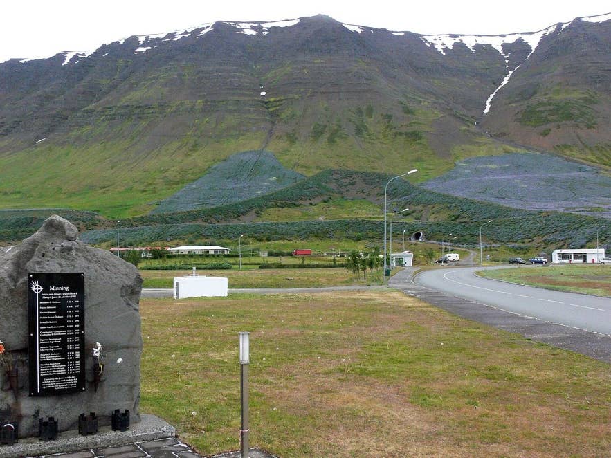 Memorial to the 1995 avalanche victims in Flateyri with the deflection dams above Memorial to the 1995 avalanche victims in Flateyri with the deflection dams above