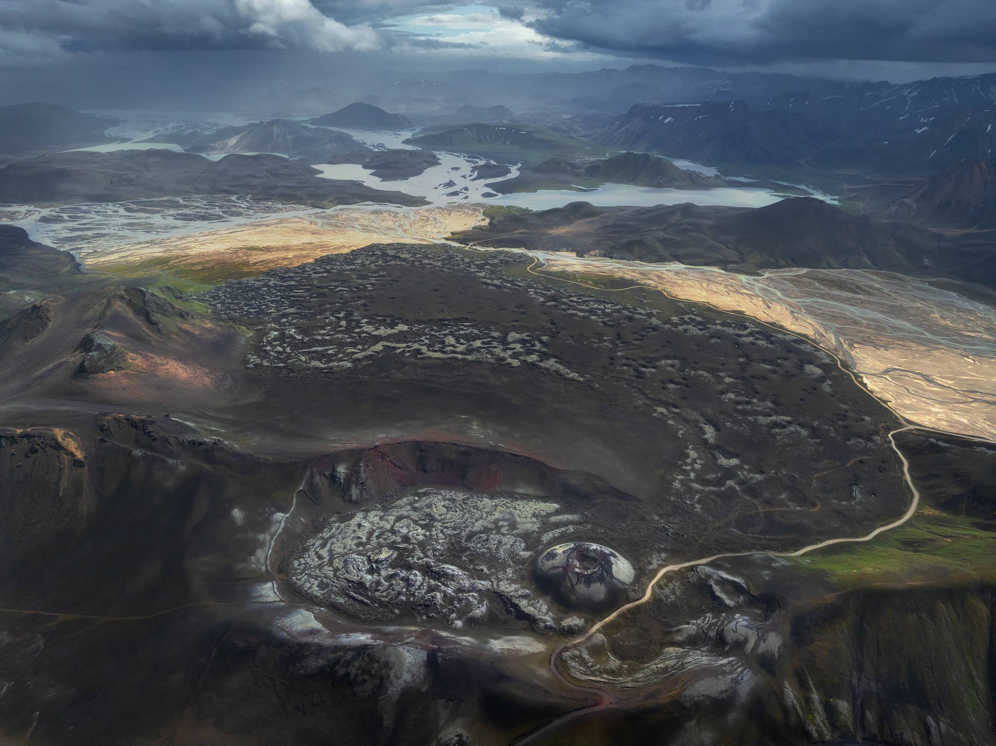 Aerial view of Stutur Crater inside a larger crater beside Namshraun Lava Field in the Highlands of Iceland.