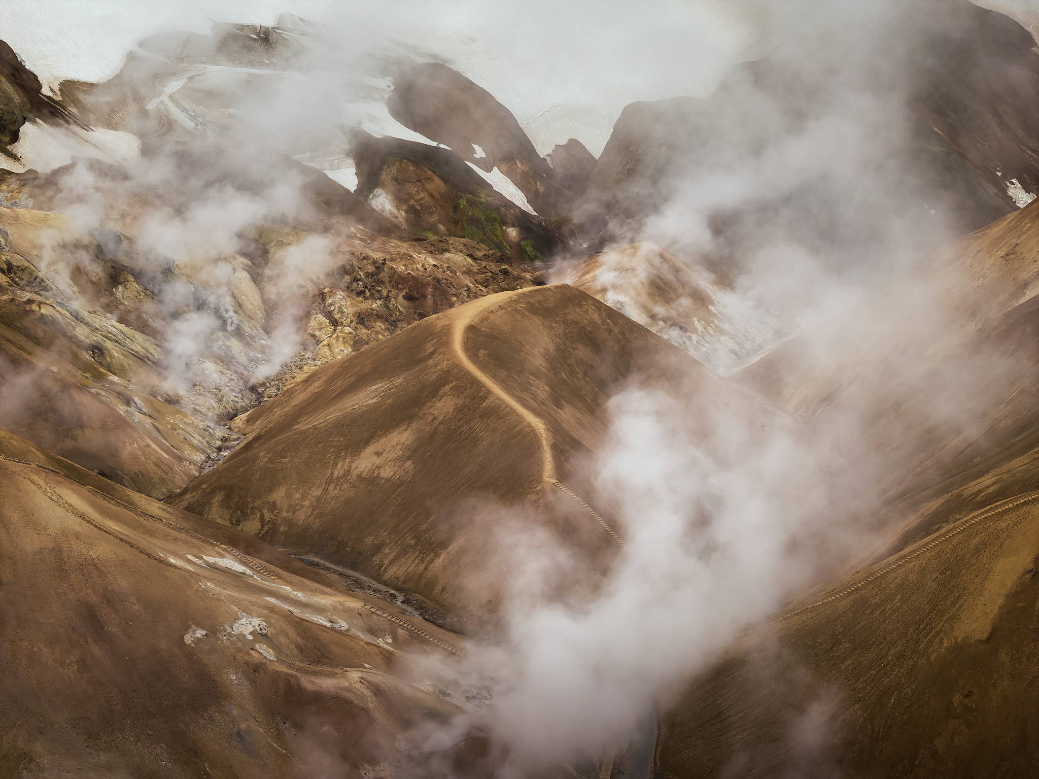 Steam rises over the hot springs of Hveradalir Geothermal Area in Kerlingarfjoll Mountains in the Highlands of Iceland.