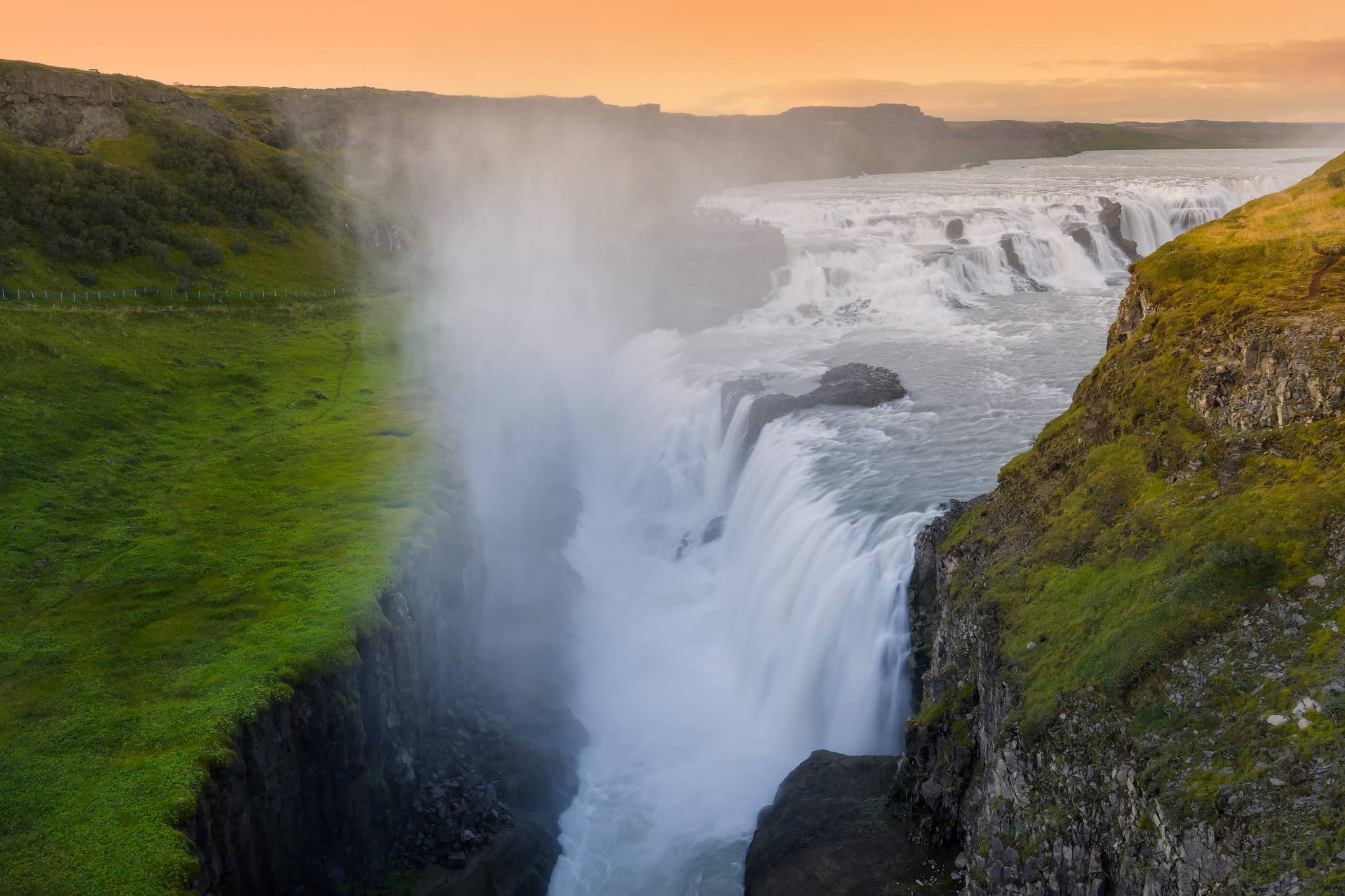 Mist rises from Gullfoss Waterfall as it tumbles into a rocky canyon at sunset on the Golden Circle.