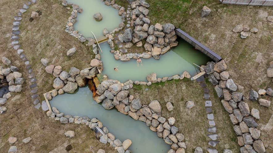 Aerial view of the Highland Baths pools and deck at Highland Base, Kerlingarfjöll