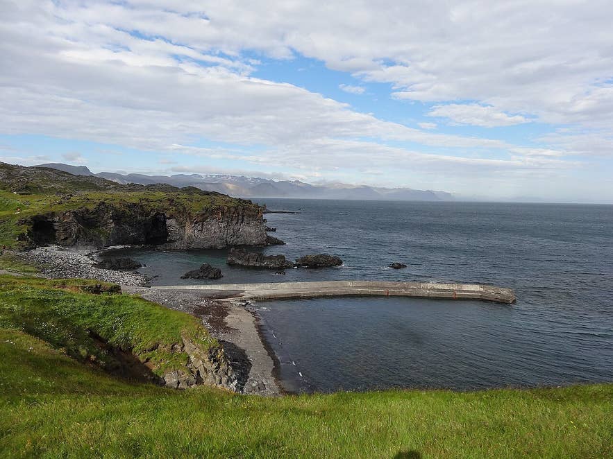 Hellnar cove with its concrete pier and the Valasnös cliffs on the Snæfellsnes coast