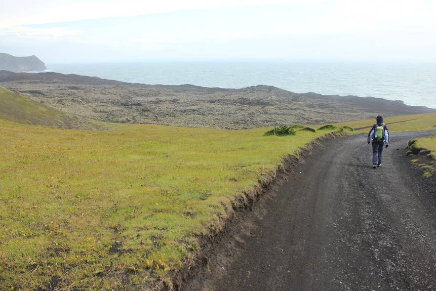 Gravel track beside the Eldfellshraun lava field on the coast of Heimaey, Westman Islands