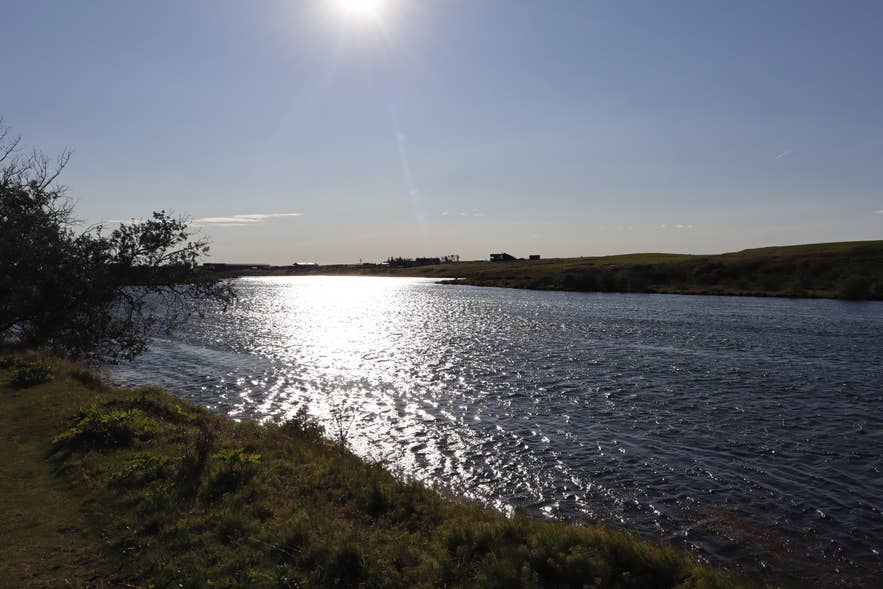 Evening sun glittering on the Ytri-Rangá river at Hella Evening sun glittering on the Ytri-Rangá river at Hella