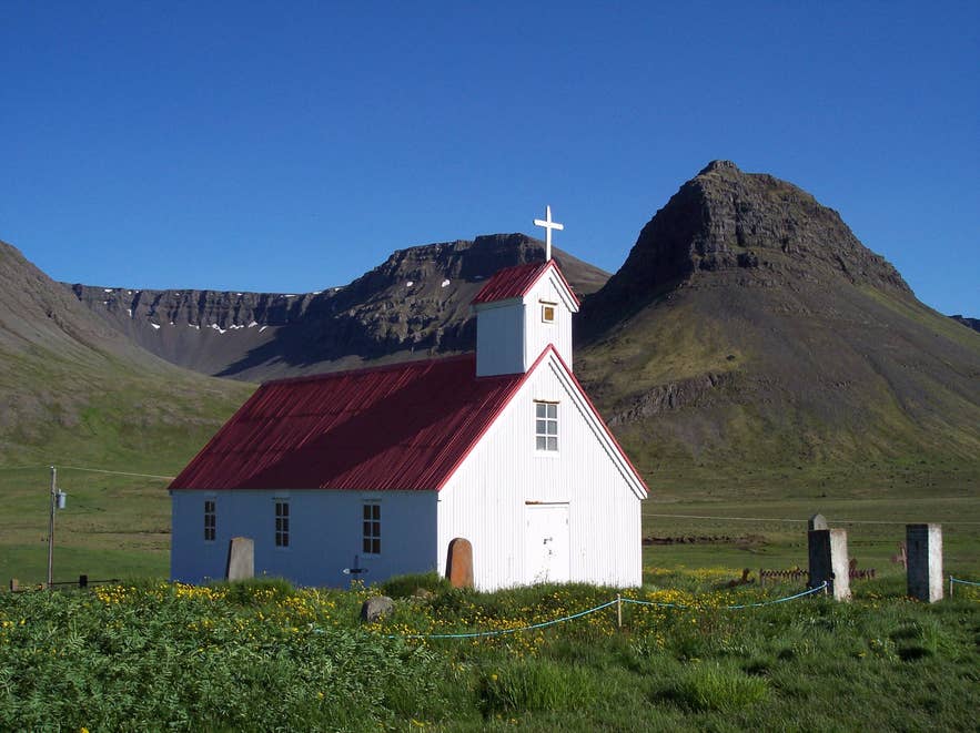 Red-roofed wooden church at Selárdalur in the Ketildalir valleys, Arnarfjörður