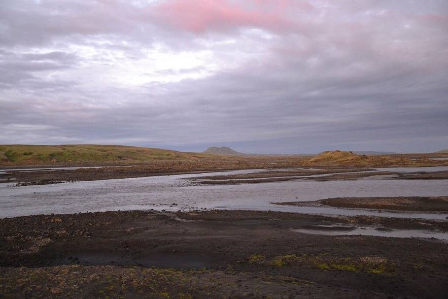 Syðri-Ófæra river spreading in braided channels over dark sand in the Fjallabak highlands