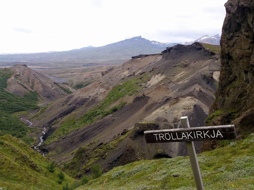 Wooden Tröllakirkja signpost on the Tindfjallahringur trail above the tuff ravines of Þórsmörk