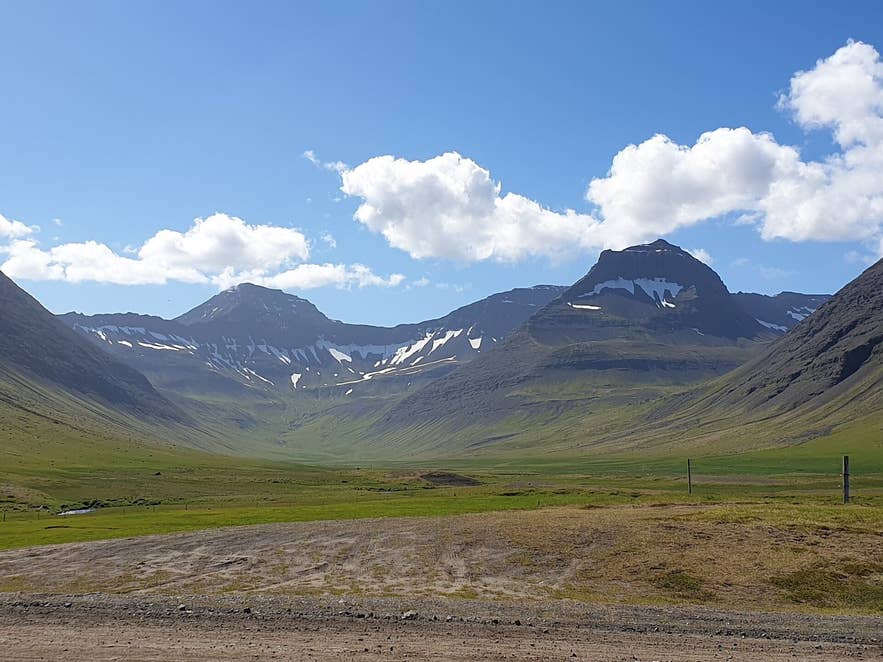 Haukadalur valley in Dýrafjörður seen from the shore road, with Kaldbakur and the mountains at the head of the valley