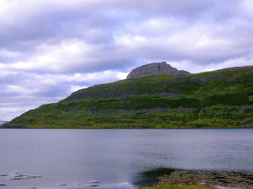Hestur mountain rising above Hestfjörður, the fjord east of Folafótur Hestur mountain rising above Hestfjörður, the fjord east of Folafótur