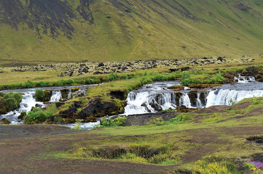 Close view of the braided Fossálar waterfalls over a lava shelf in South Iceland