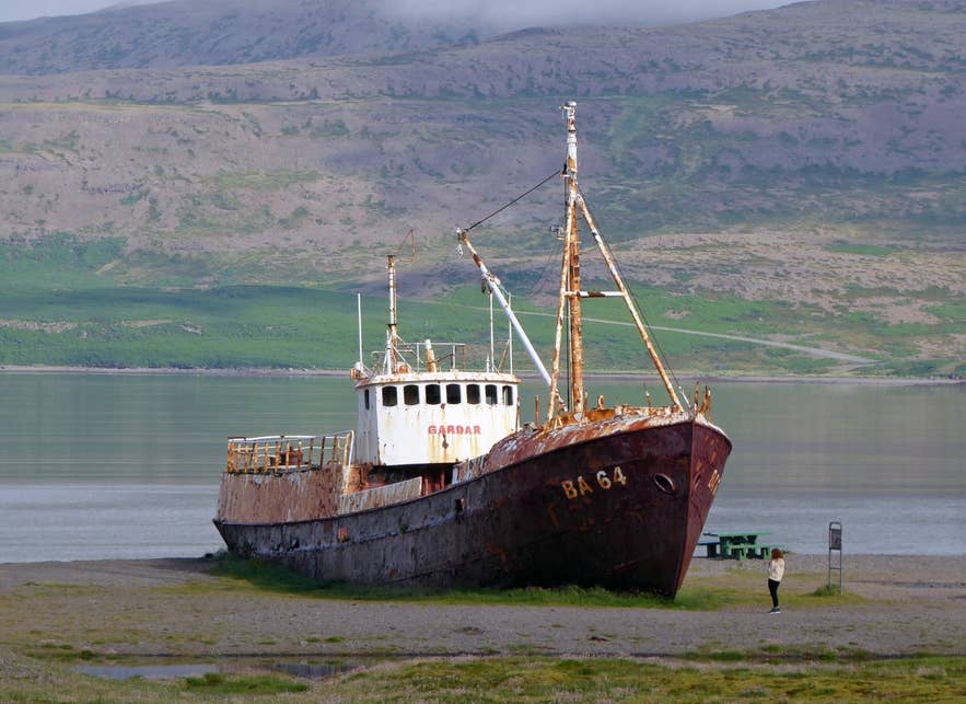 The rusting Garðar BA 64 shipwreck on the south shore of Patreksfjörður near Hvalsker