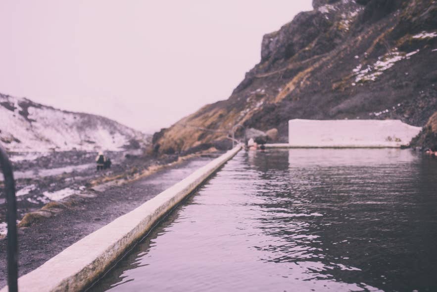 The 1923 Seljavallalaug swimming pool under the Eyjafjöll slopes, start of the Lambafellsheiði route