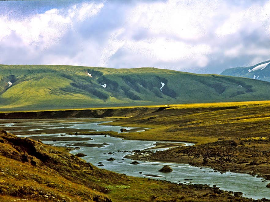 Braided stream and green móberg slopes near Landmannahellir at the foot of Hellisfjall, Fjallabak Nature Reserve, 1974
