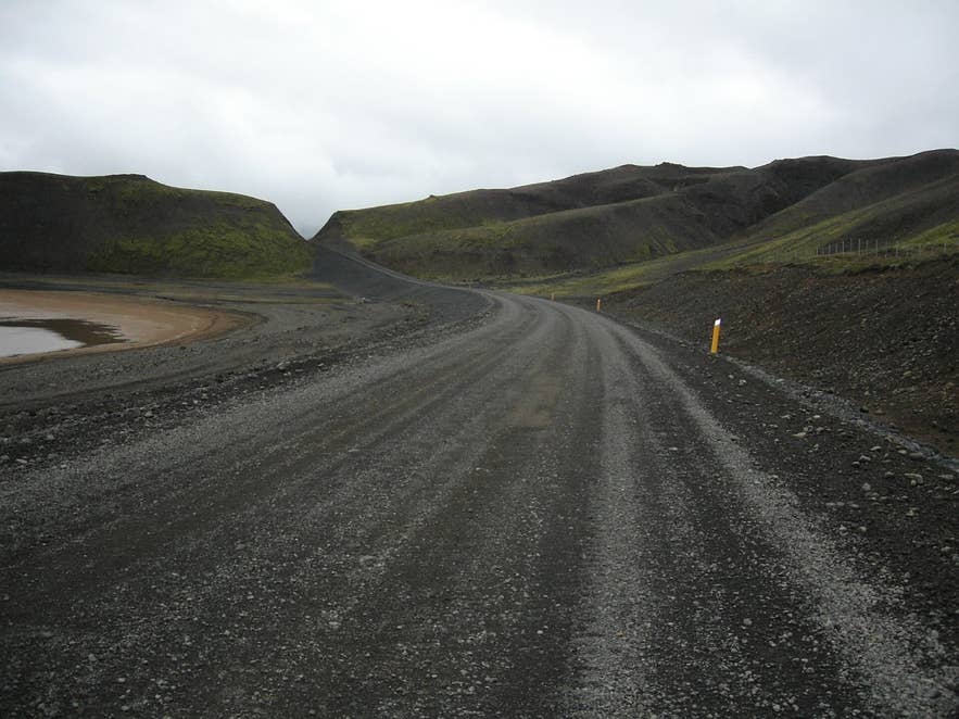 Gravel Route 52 beside the almost dry bed of Sandkluftavatn lake in September Gravel Route 52 beside the almost dry bed of Sandkluftavatn lake in September