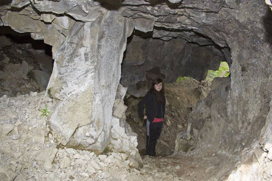 Interior of Þvottahellir cave on the Glymur hiking trail with daylight entering through rock openings Interior of Þvottahellir cave on the Glymur hiking trail with daylight entering through rock openings