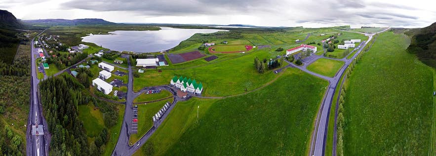 Aerial view of Lake Laugarvatn and Laugarvatn village, the lake drained by the Hólaá river