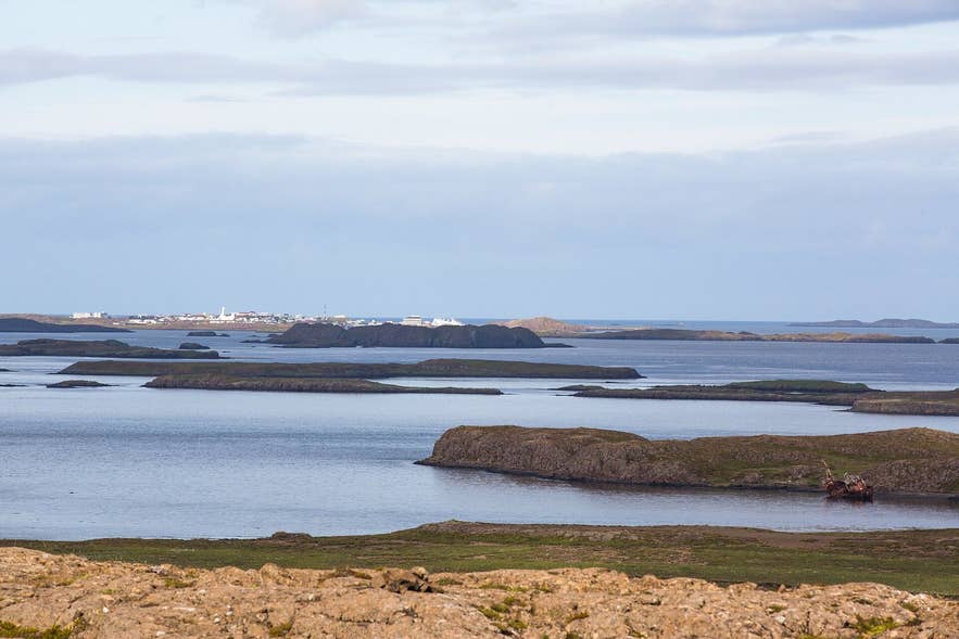 Shipwreck on Landey island off Stykkishólmur, Breiðafjörður, with the town in the background Shipwreck on Landey island off Stykkishólmur, Breiðafjörður, with the town in the background