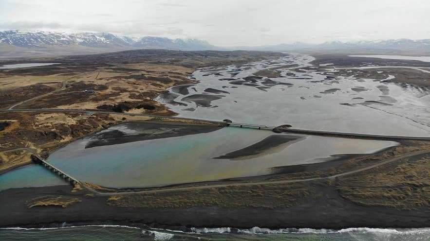 Aerial view of the braided mouth of Héraðsvötn east of Sauðárkrókur, Skagafjörður, with the Route 75 bridge