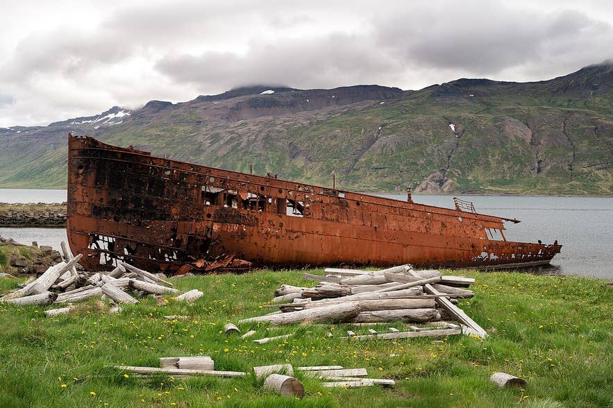 The rusted hull of the Suðurland shipwreck on the shore at Djúpavík, Reykjarfjörður
