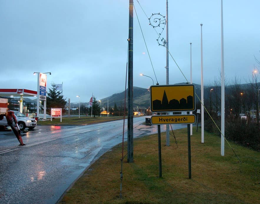 Entrance to Hveragerði from Route 1 with the town sign and petrol station beside the Sunnumörk shopping centre