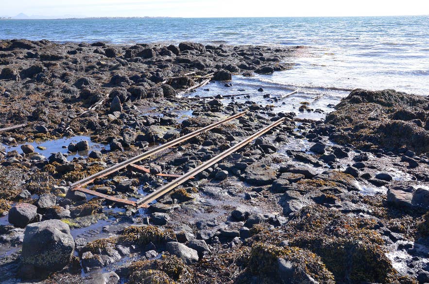 Old slipway rails on the rocky shore at Grímsstaðavör, Ægisíða, Reykjavík