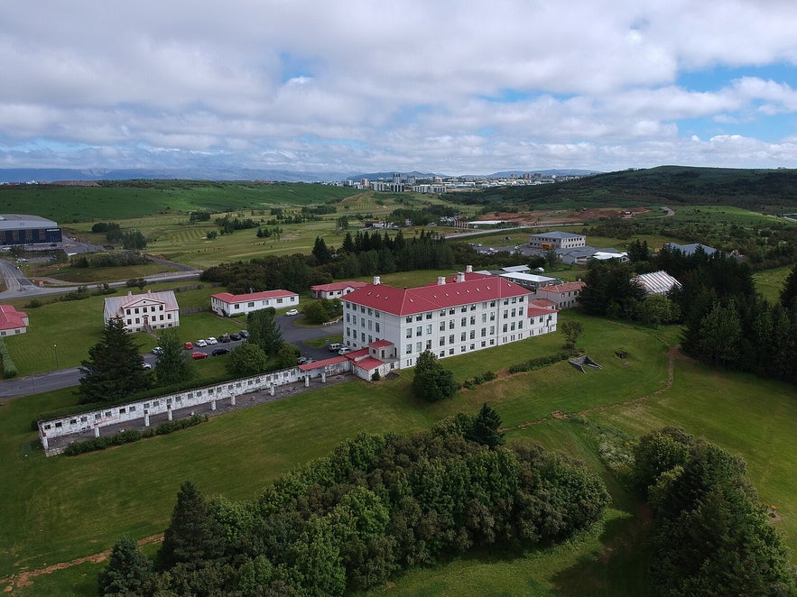 Vifilsstadir provides temporary care for older adults while they wait for a placement in a long-term care facility and is surrounded by beautiful parkland a lake.