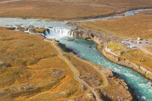 Lush valleys surround the Godafoss waterfall in North Iceland.