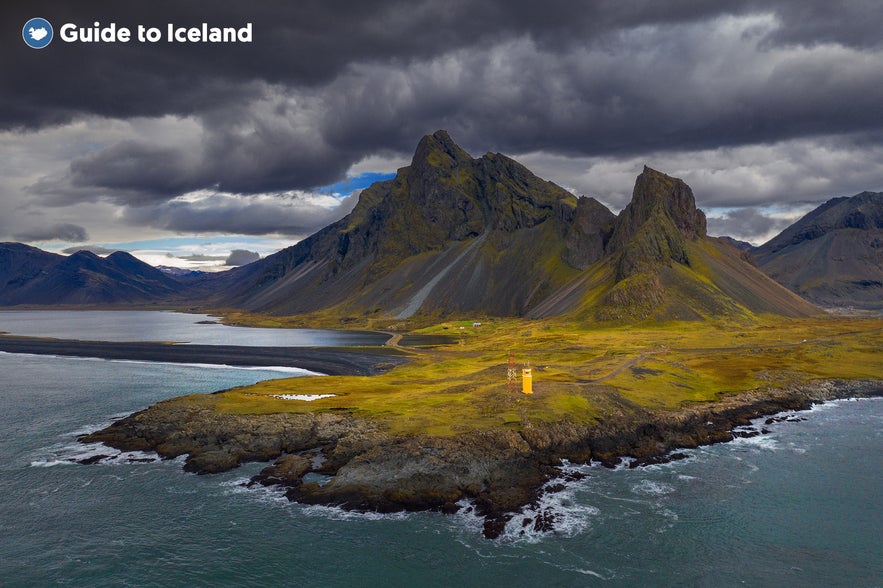 Hvalnes lighthouse nestles at the foot of Mount Eystrahorn in Iceland.