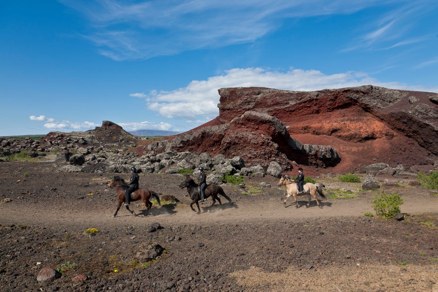 Riding through RauÃ°hÃ³lar on Volcanic landscape horse riding tour